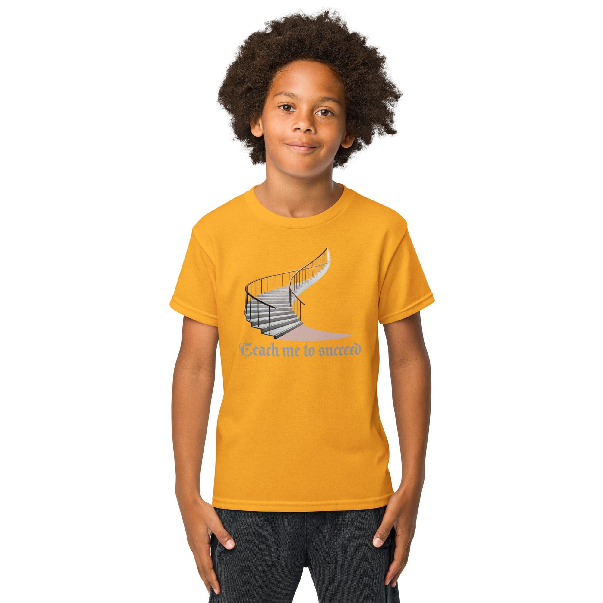 Boy wearing a yellow graphic t-shirt.