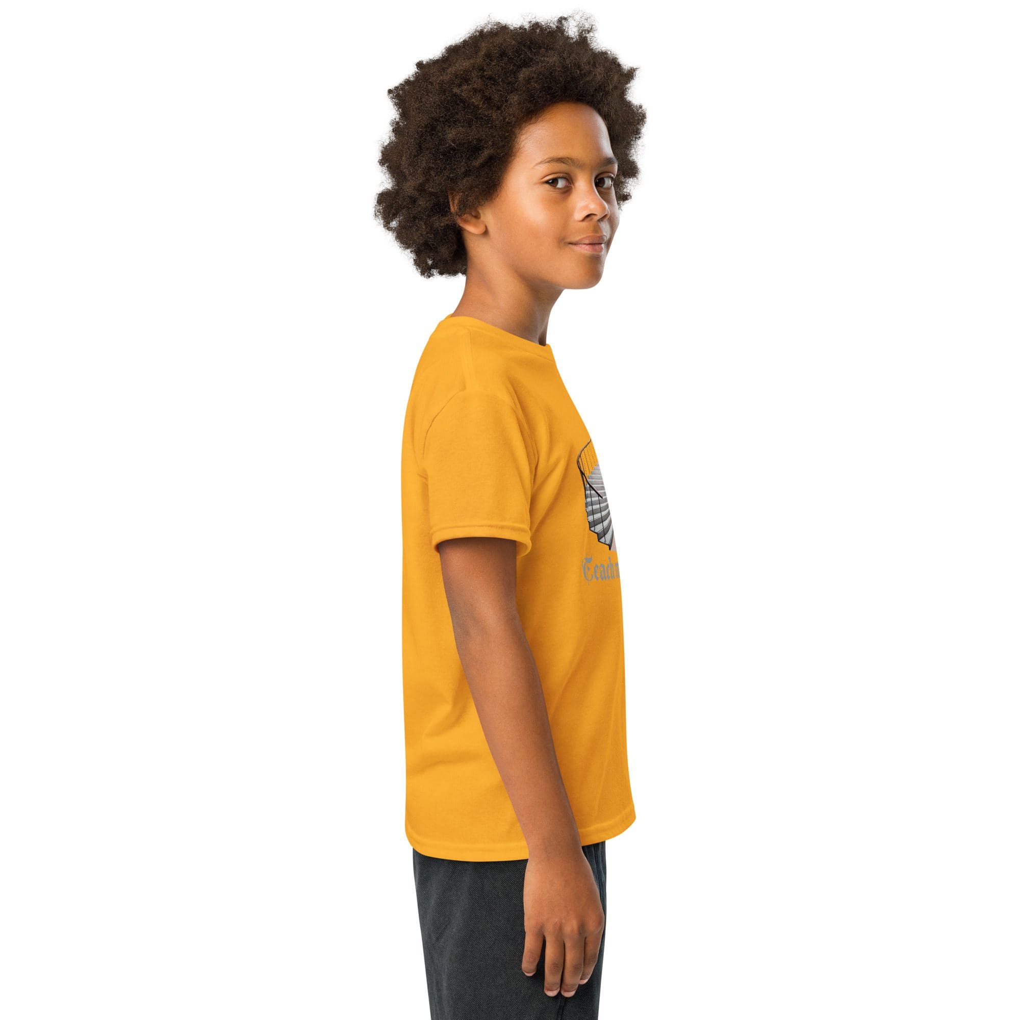 Curly-haired child in yellow tee, side profile