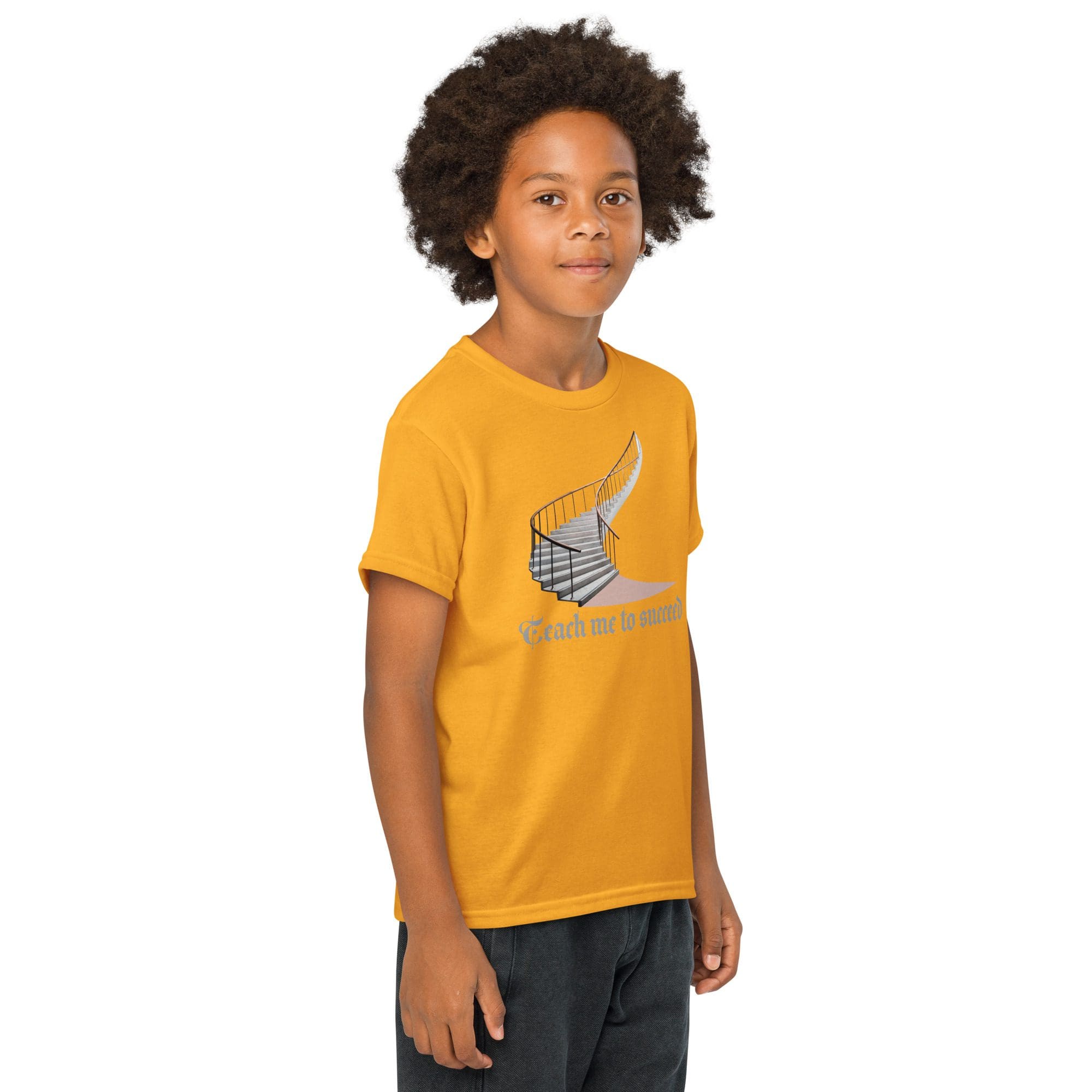 Child in yellow shirt, smiling, standing sideways.