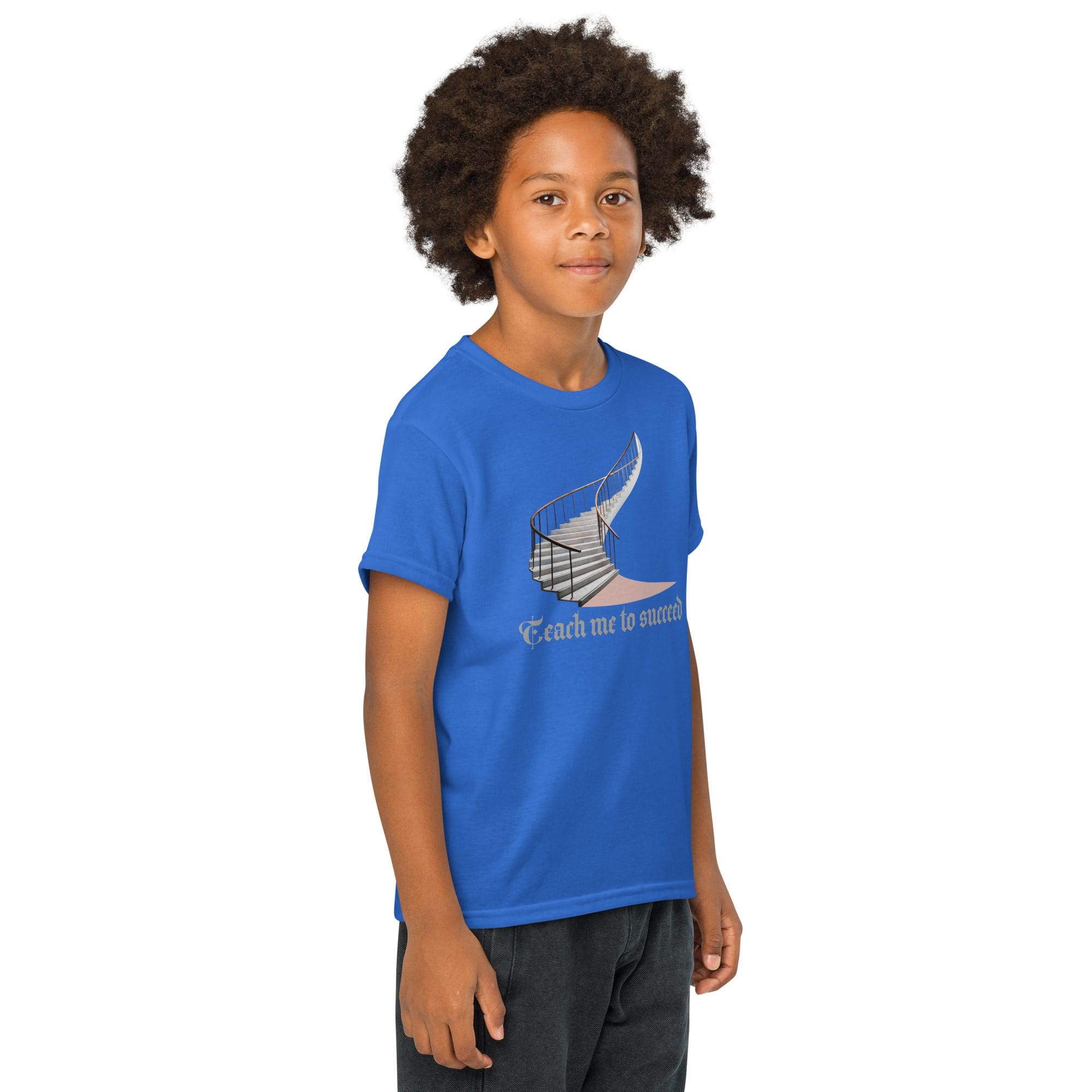 Child wearing blue t-shirt, smiling confidently.