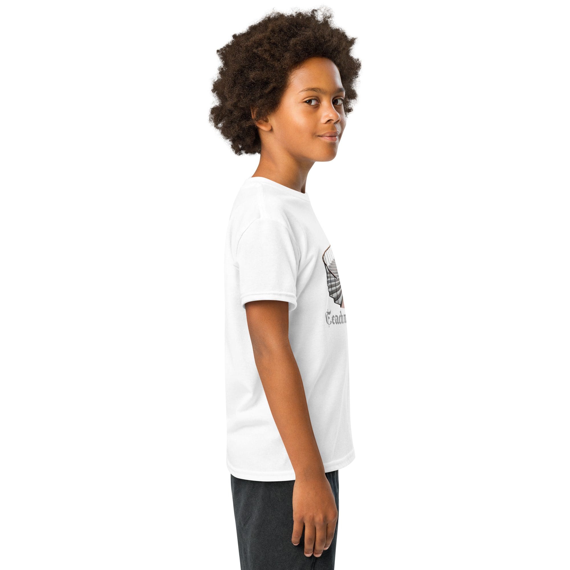 Young boy in white t-shirt smiling.