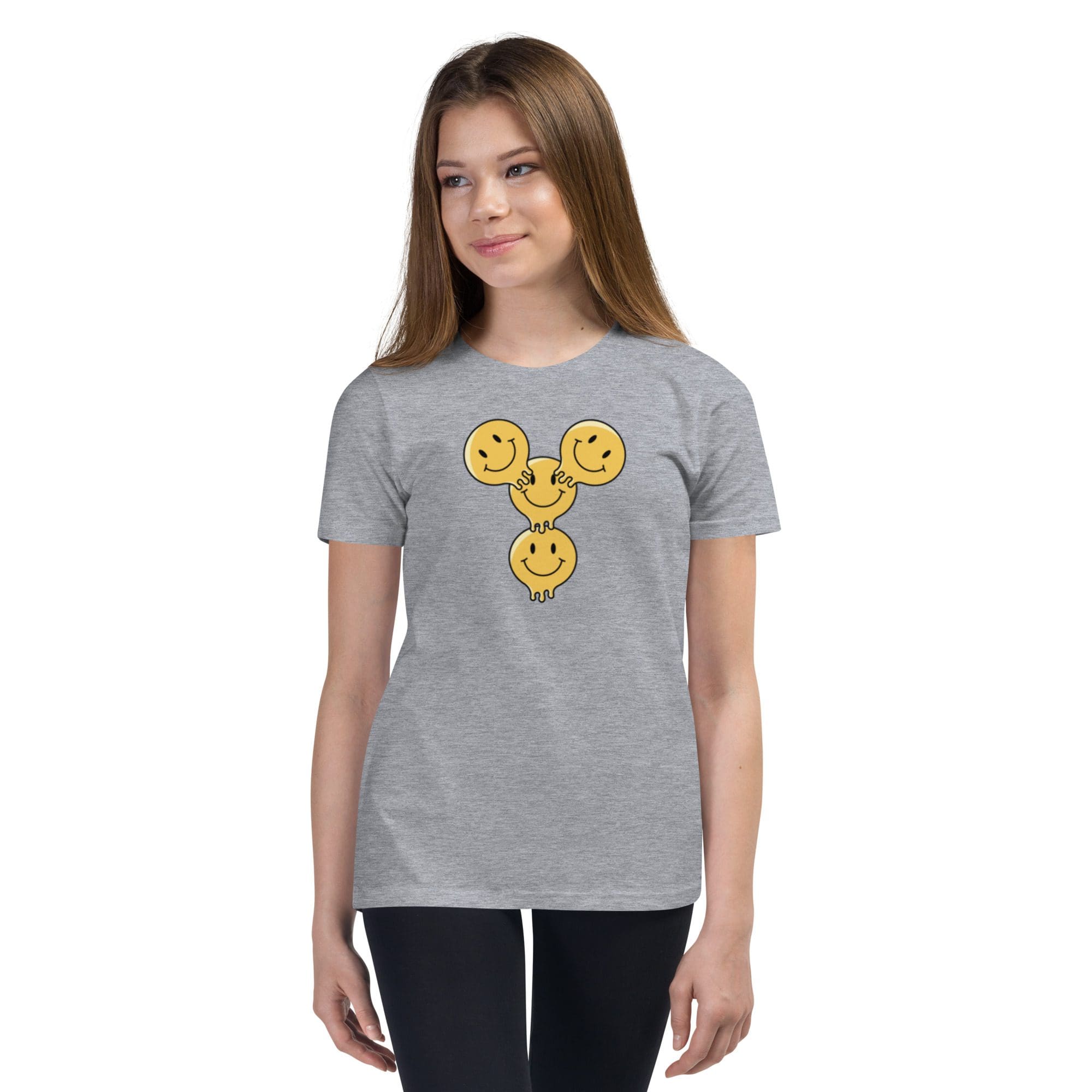 Young woman in gray smiley face shirt.