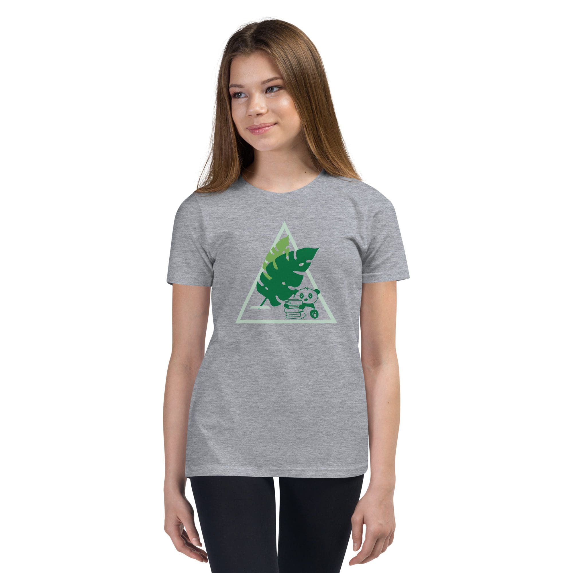 Woman wearing gray leaf-print t-shirt.