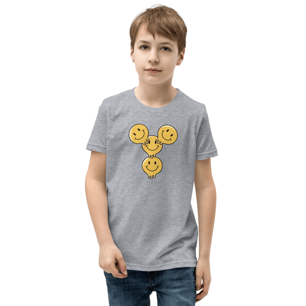 Boy wearing grey shirt with smiley faces.