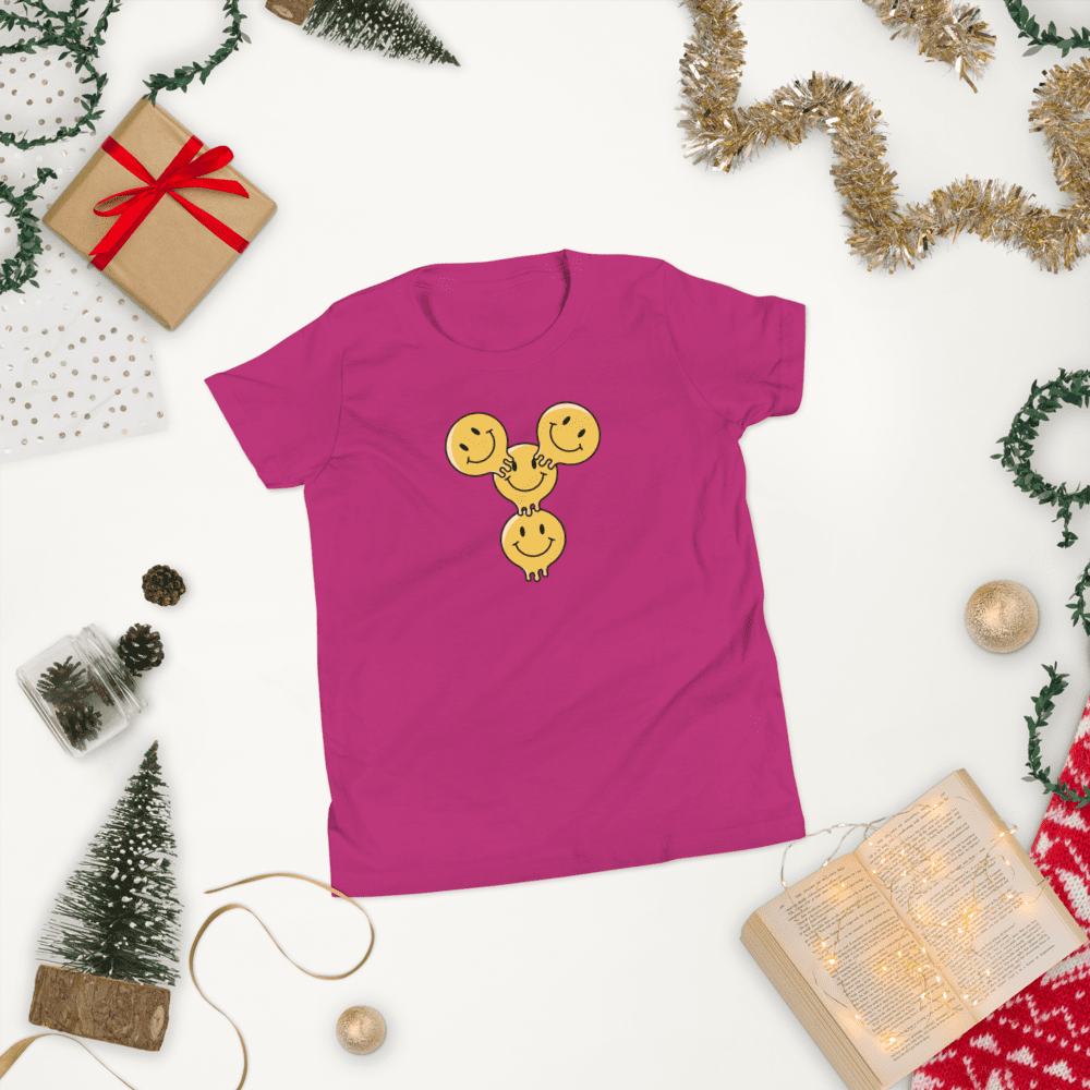 Pink shirt with smiling faces design.