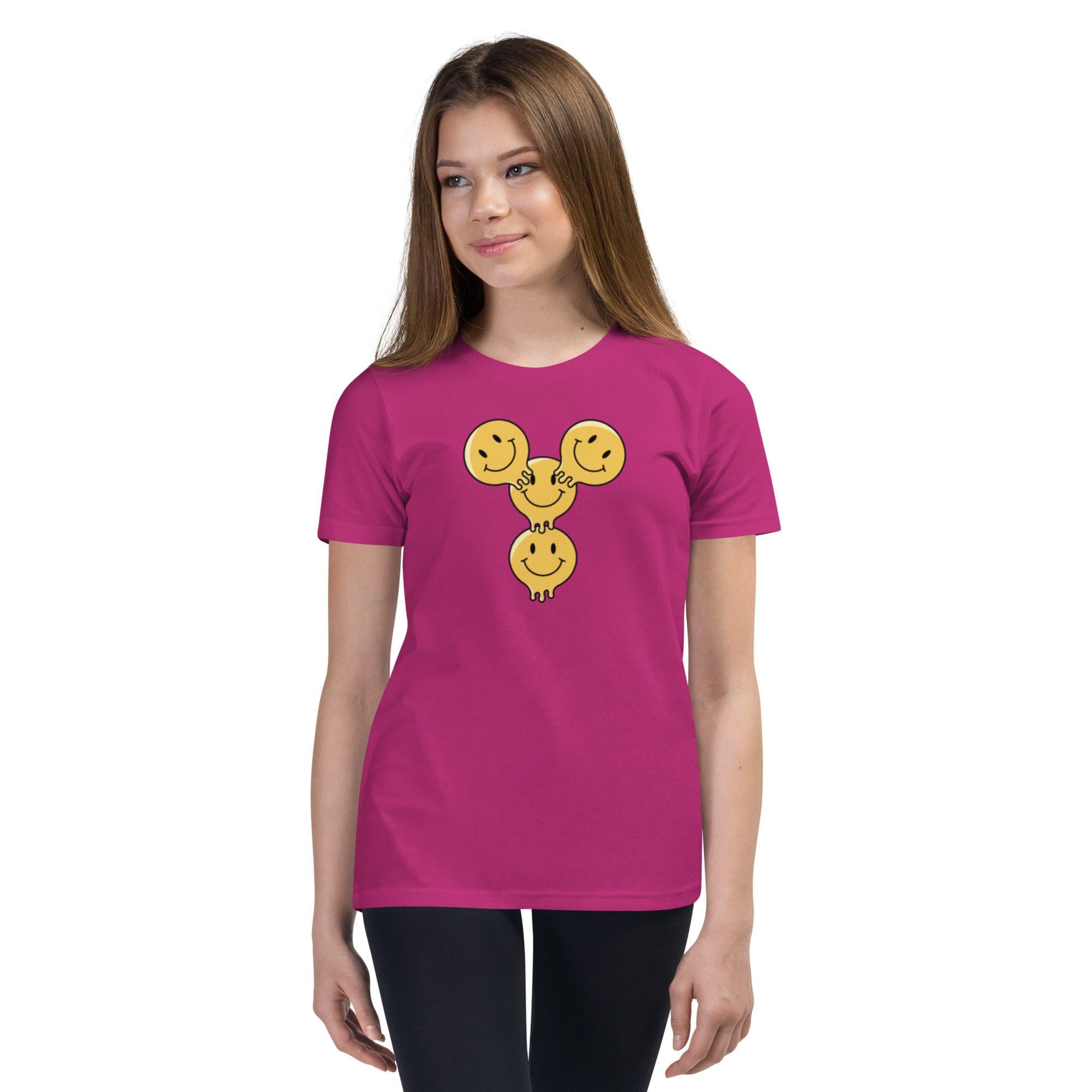 Girl wearing pink shirt with smiley design.