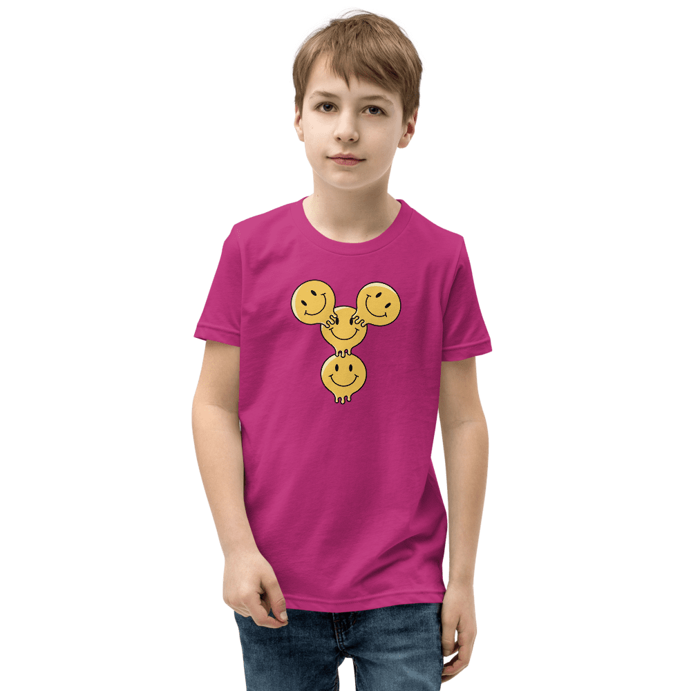 Boy wearing pink t-shirt with smiley design.