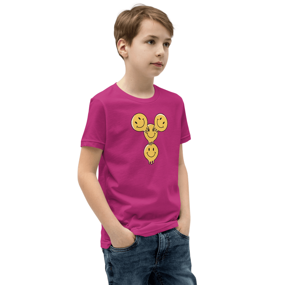 Boy in pink shirt with smiley design.