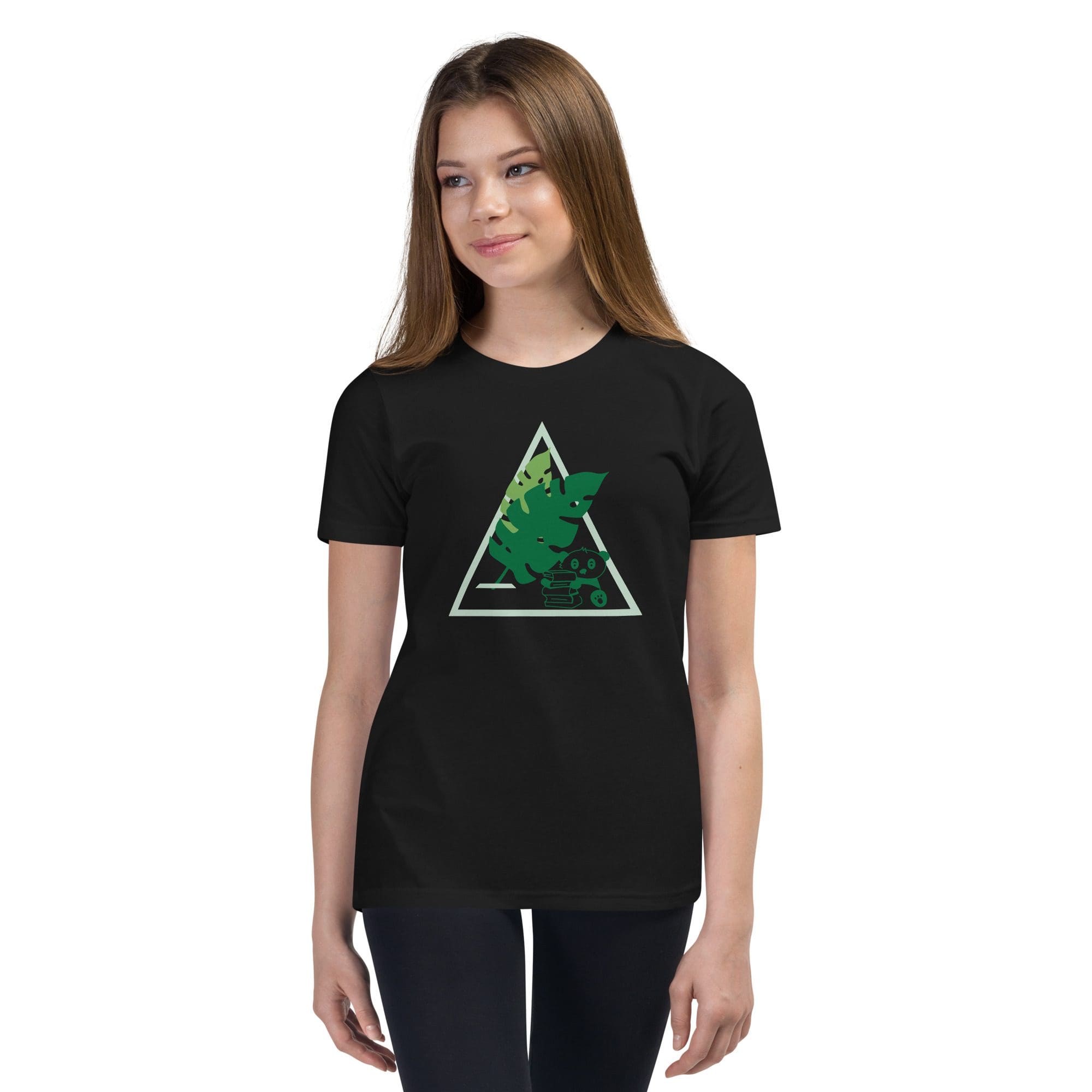Girl wearing black T-shirt with green design.
