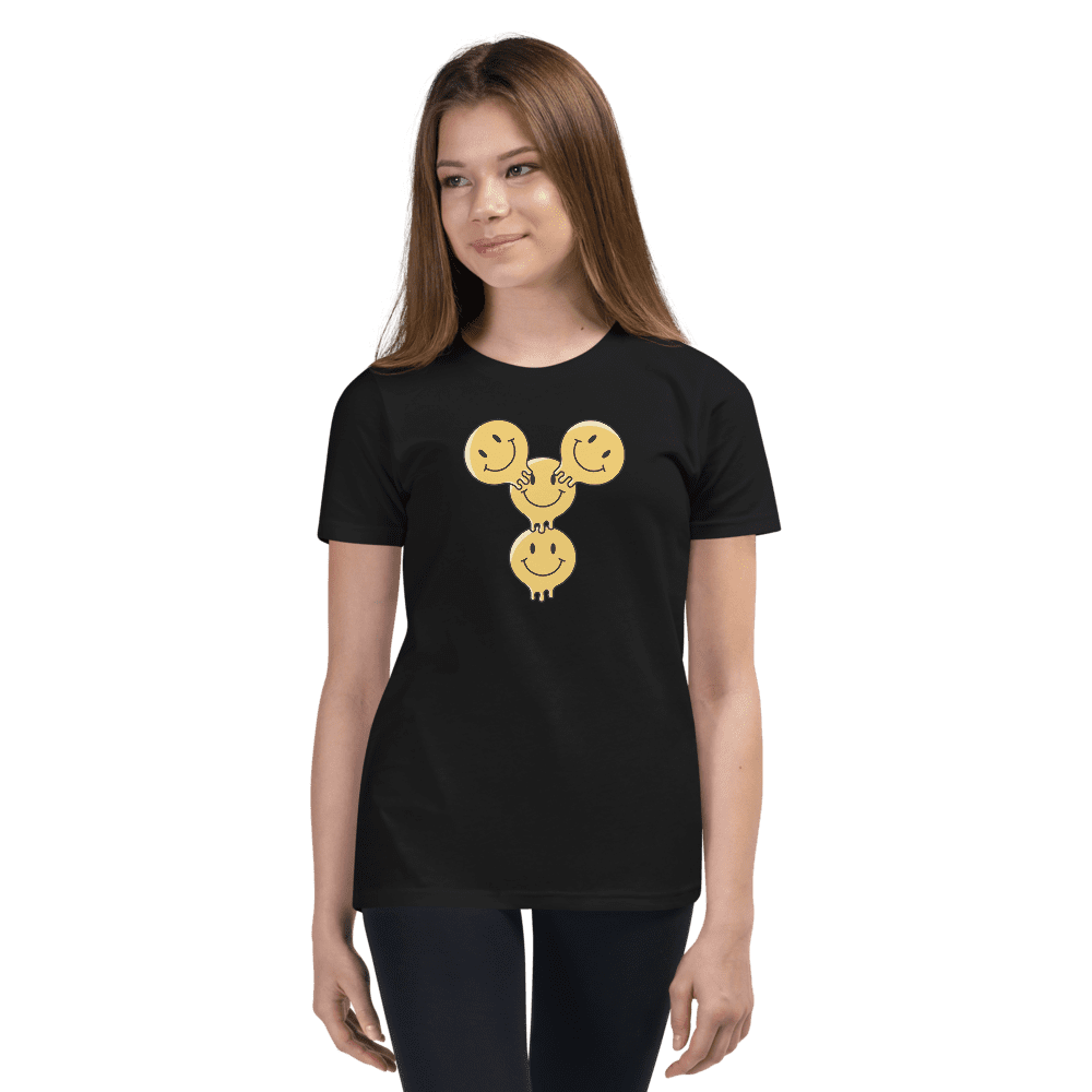 Woman wearing black t-shirt with smiley design.