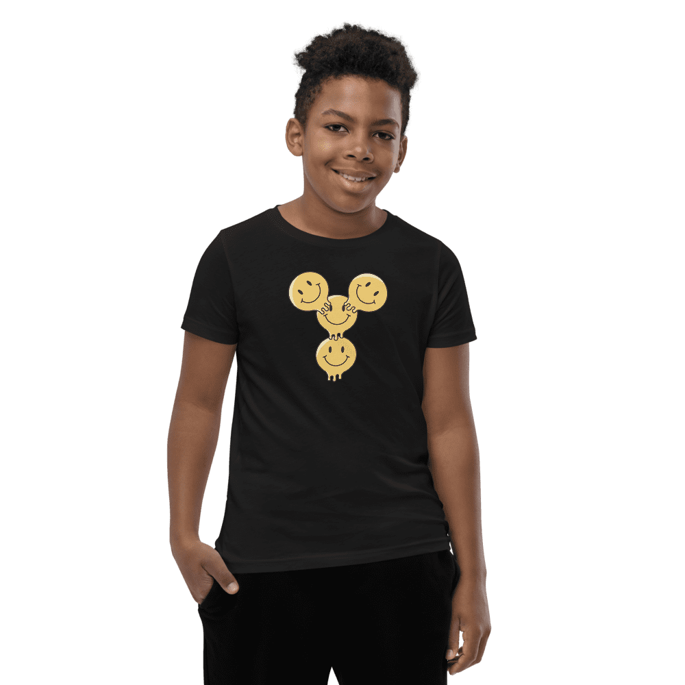 Boy wearing shirt with smiley face design.