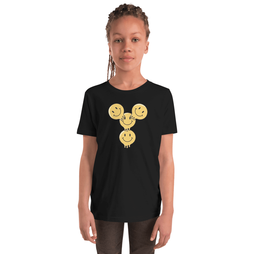 Child wearing black shirt with smiley design.