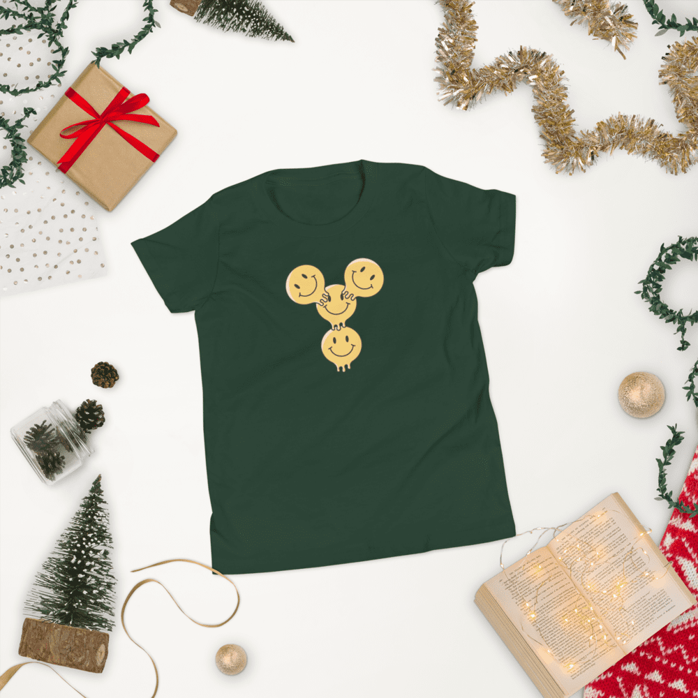 Green shirt with smiling cookie design.