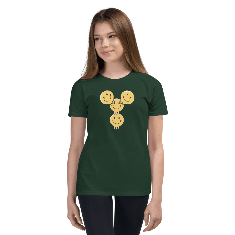 Woman in green shirt with smiley design.