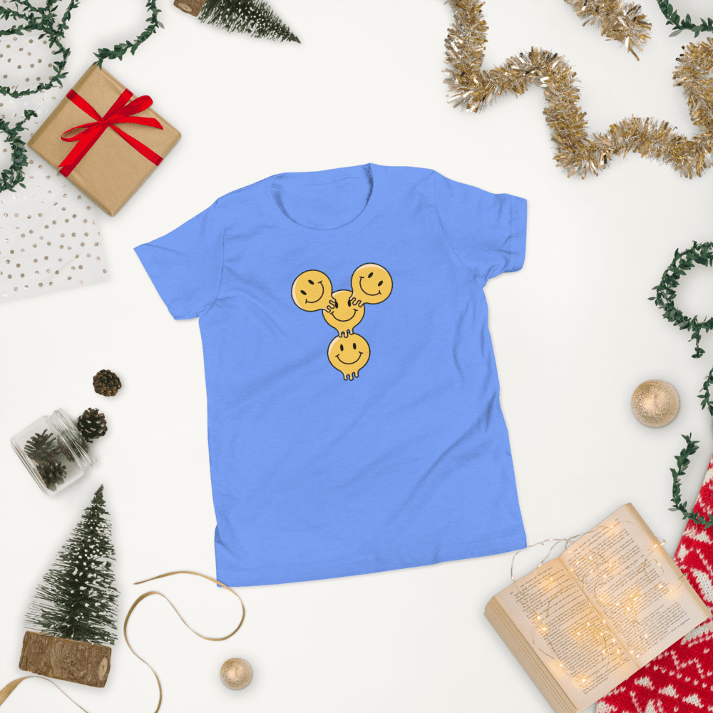 Blue shirt with smiling faces design.