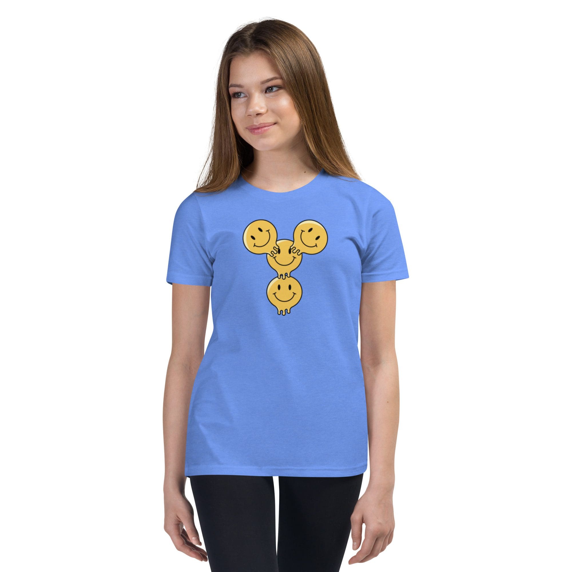 Girl wearing blue shirt with smiley design.