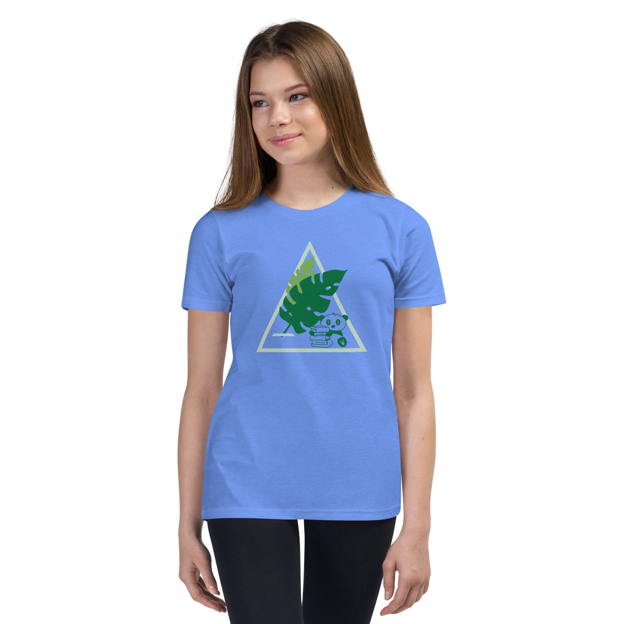 Girl wearing blue t-shirt with leaf design.