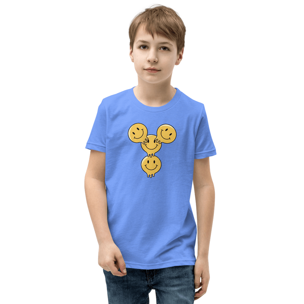 Boy wearing blue shirt with smiley design.
