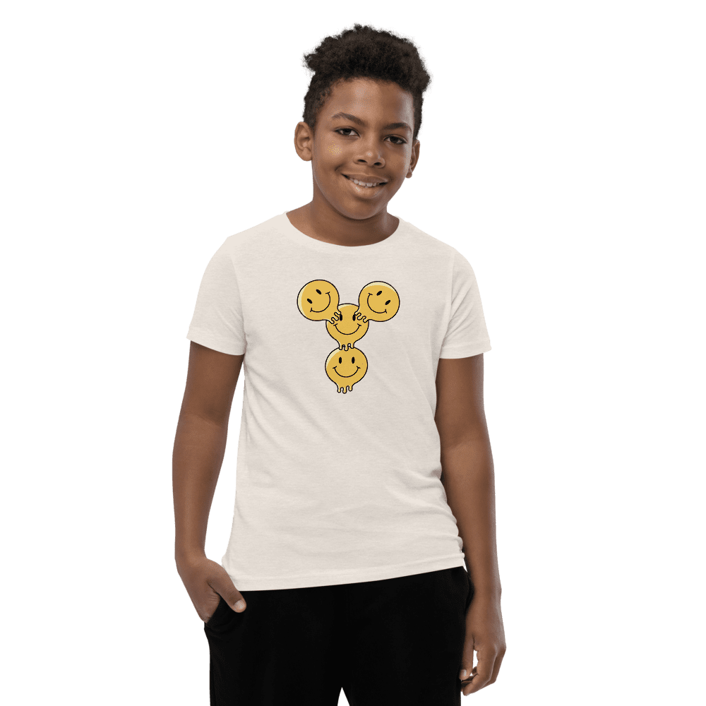 Boy wearing a smiley face t-shirt.