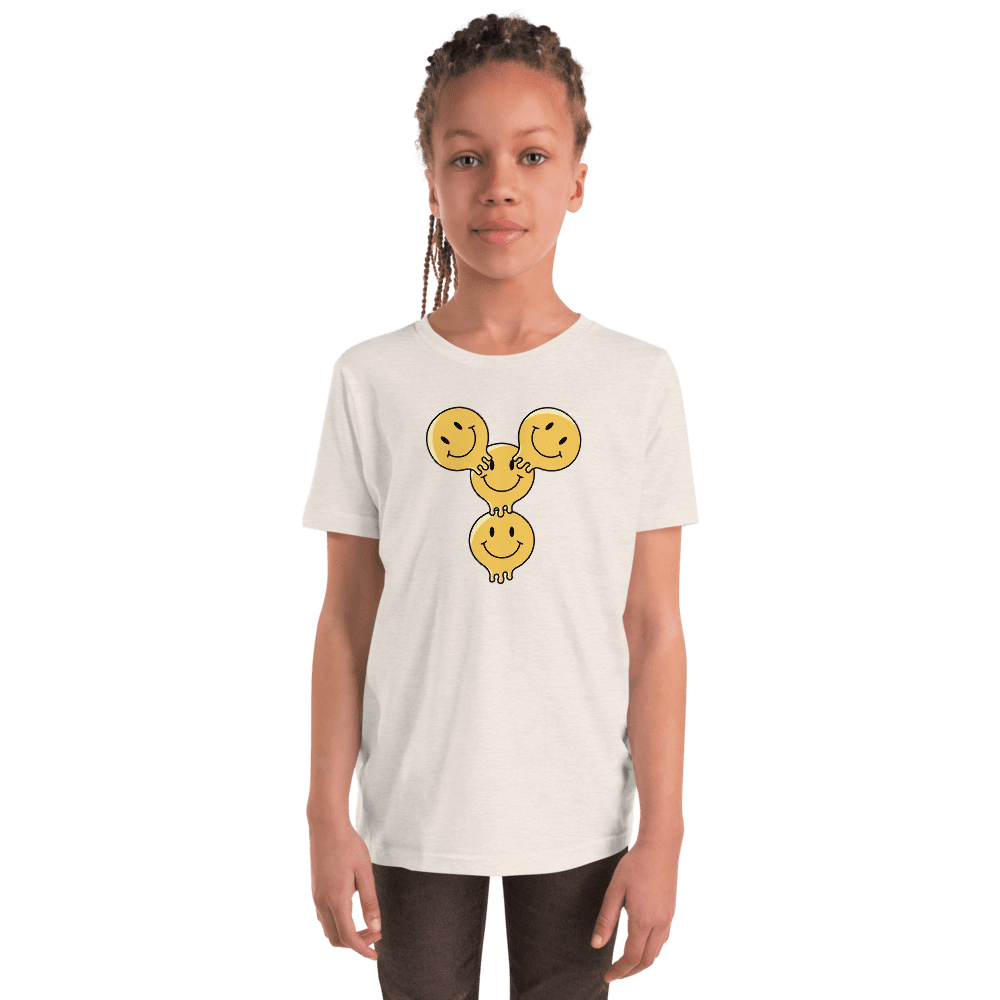 Child wearing shirt with smiley face design.