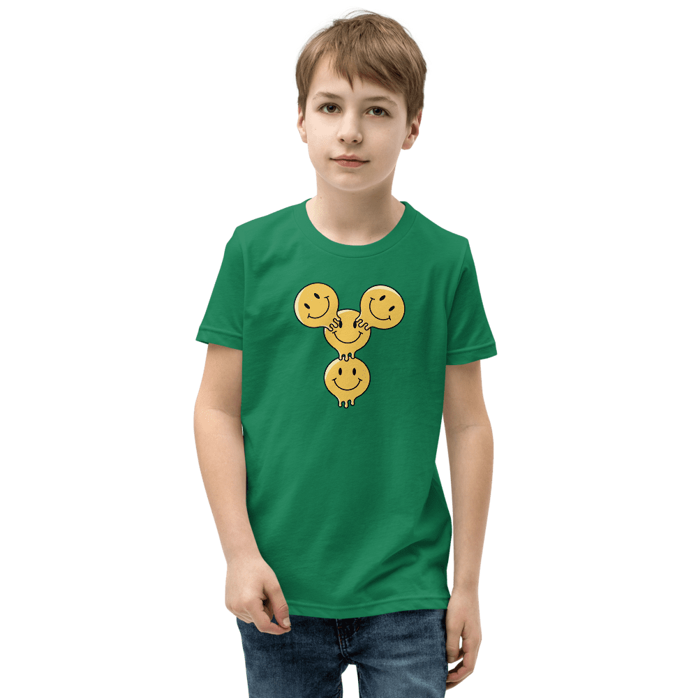 Boy wearing green t-shirt with smiley design.