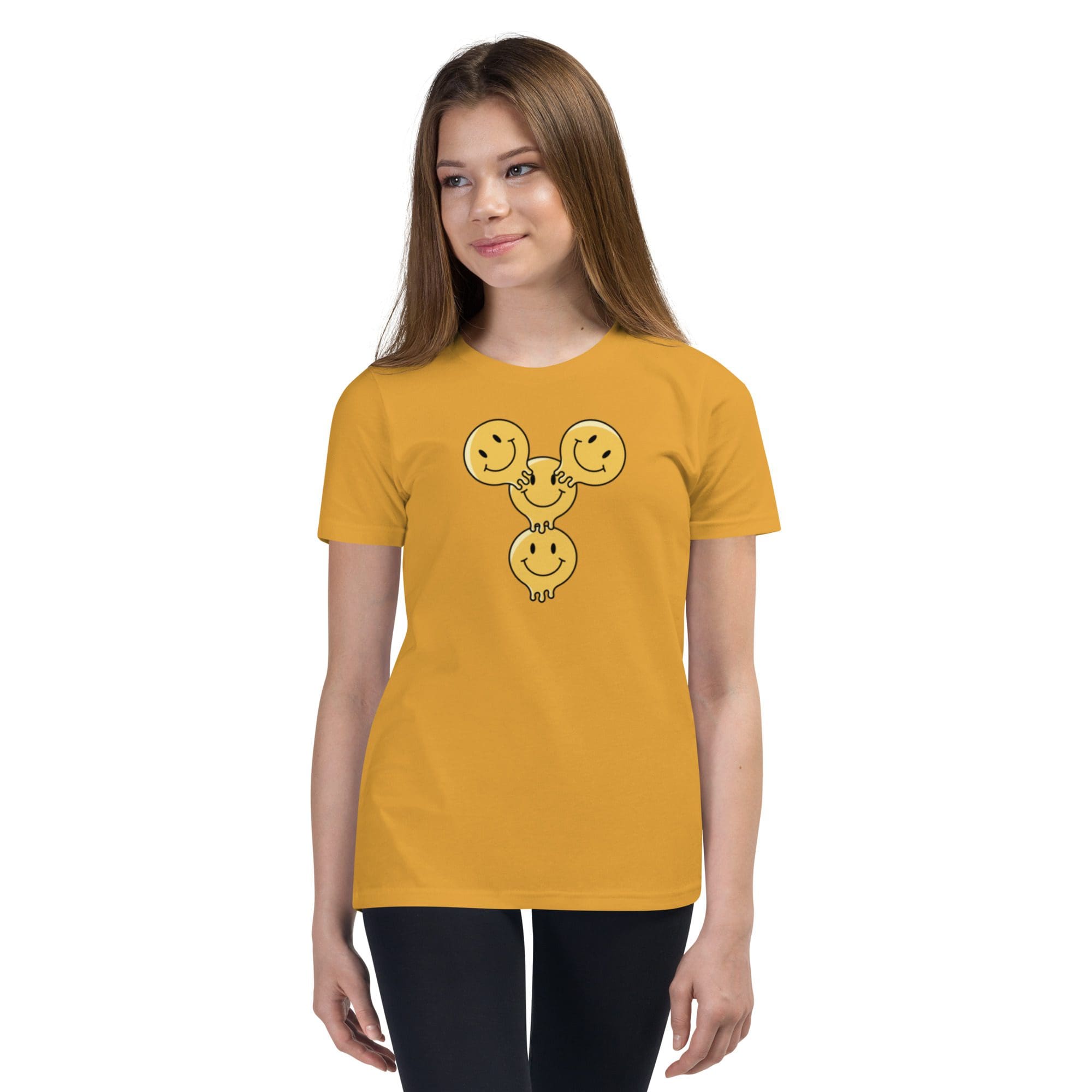 Girl wearing a yellow smiley face shirt.