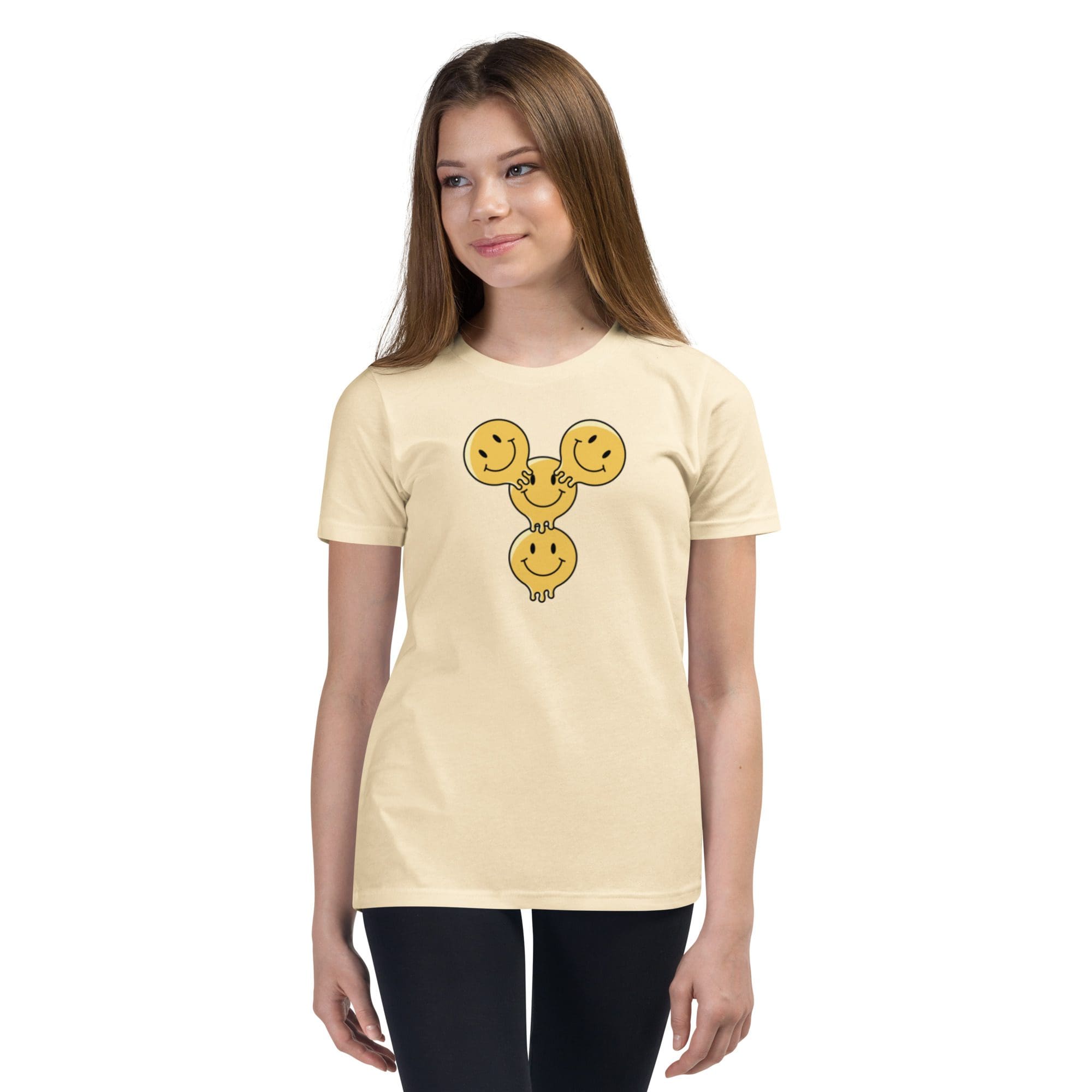 Girl wearing shirt with smiley face design.