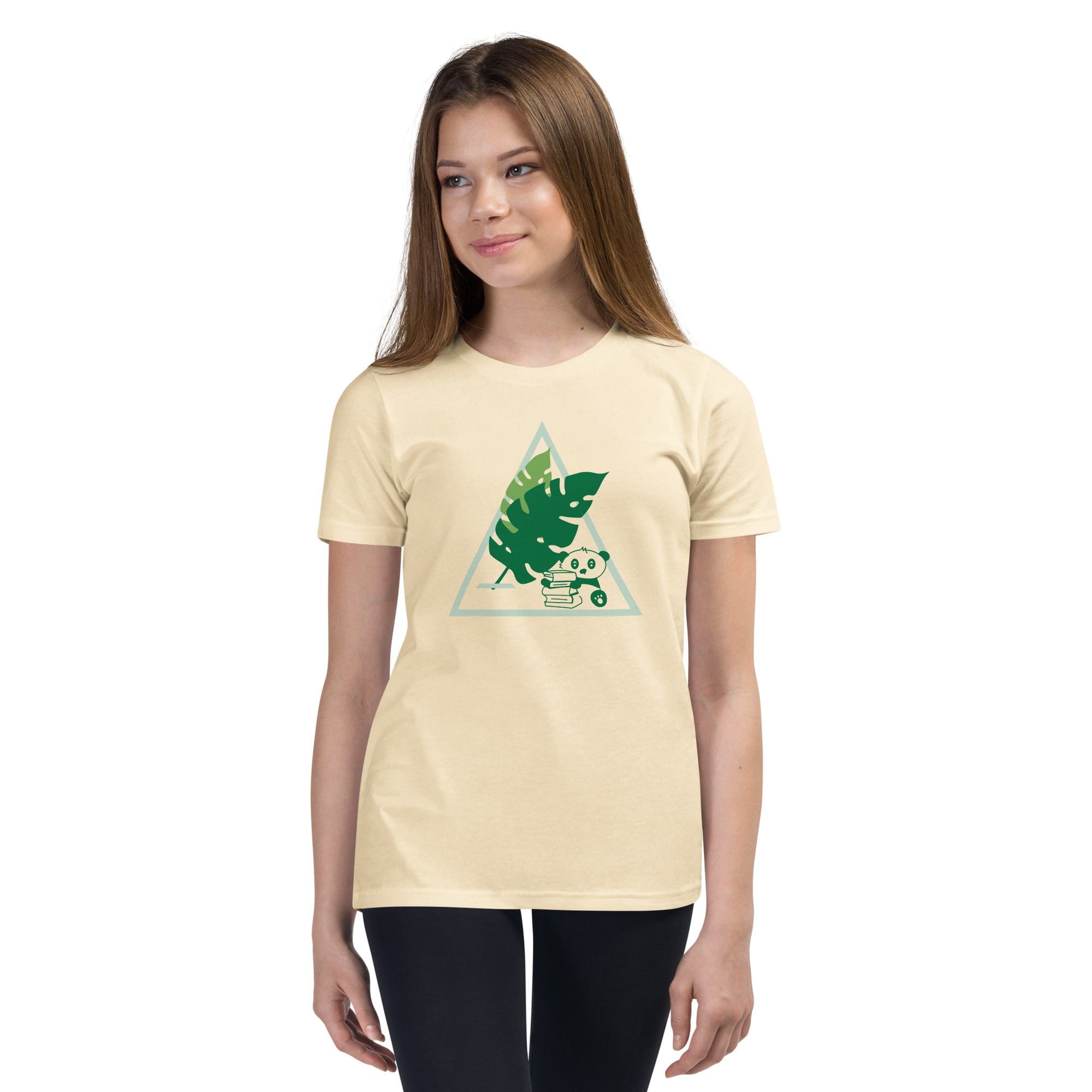 Girl wearing a leaf print t-shirt.