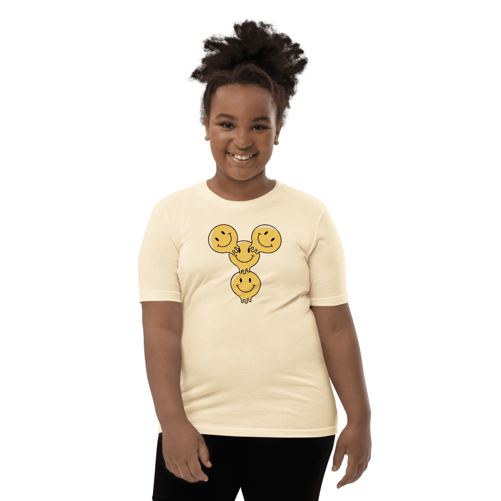 Smiling person in white shirt with emojis.