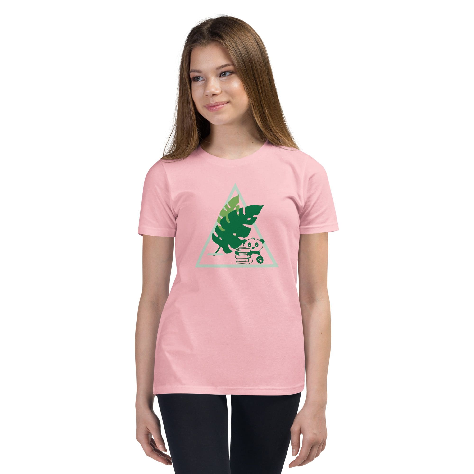 Girl wearing pink shirt with leaf design.