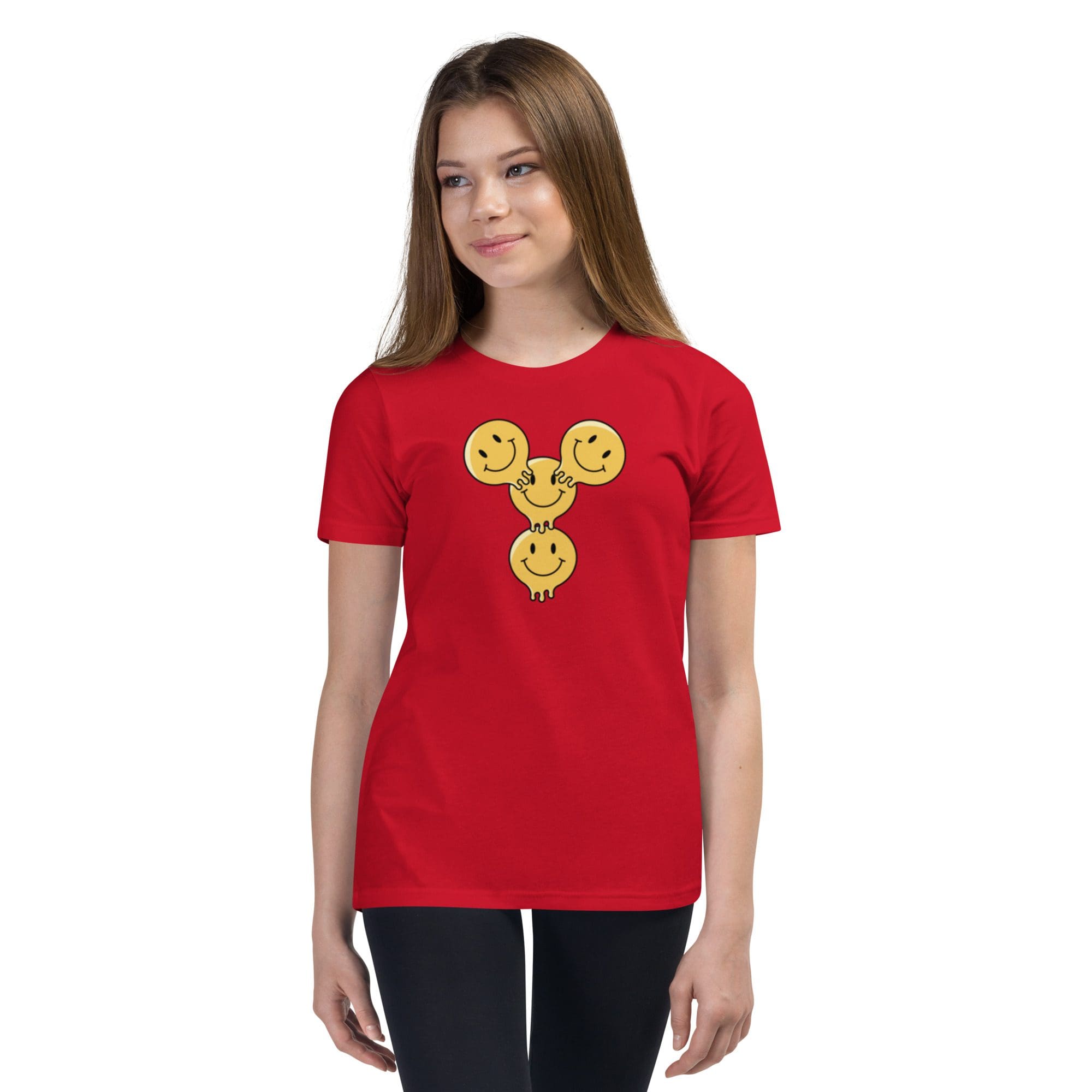 Girl wearing red shirt with smiley design.