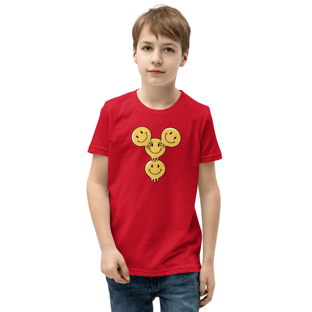Boy wearing red shirt with smiley faces.