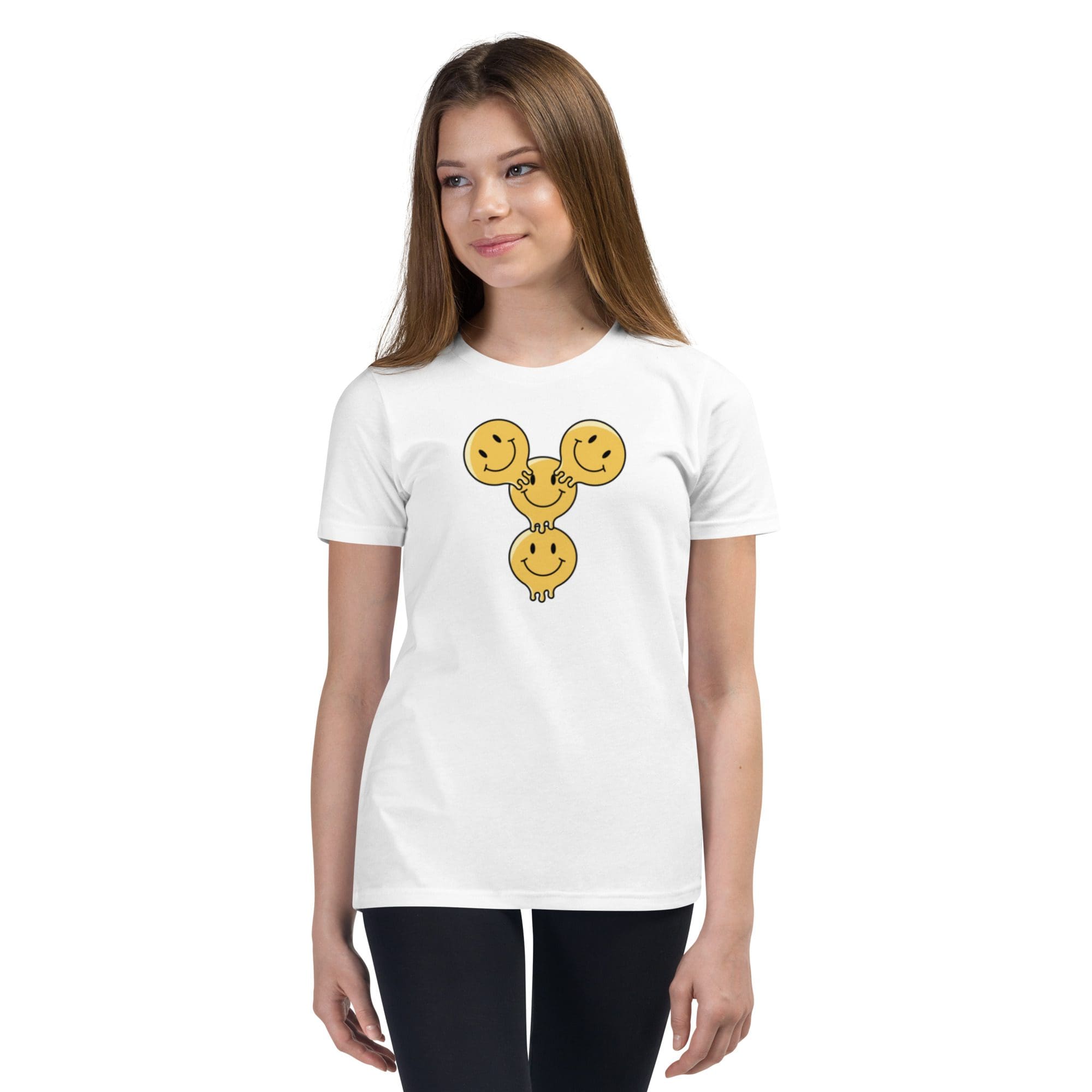 Girl wearing smiley face t-shirt, smiling.