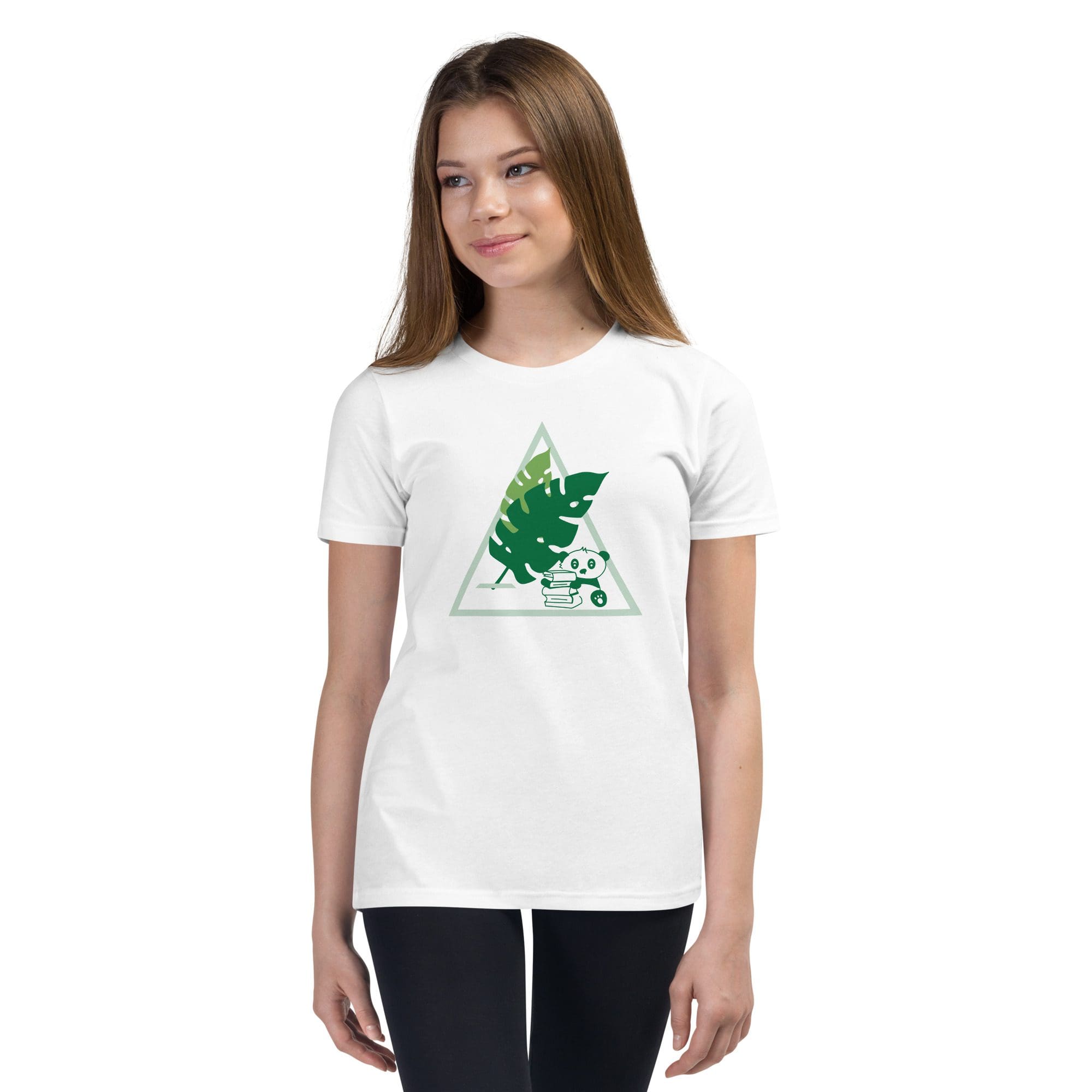 Girl wearing white t-shirt with leaf design.