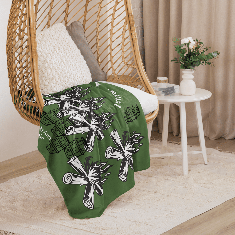 Cozy wicker hanging chair with green patterned blanket