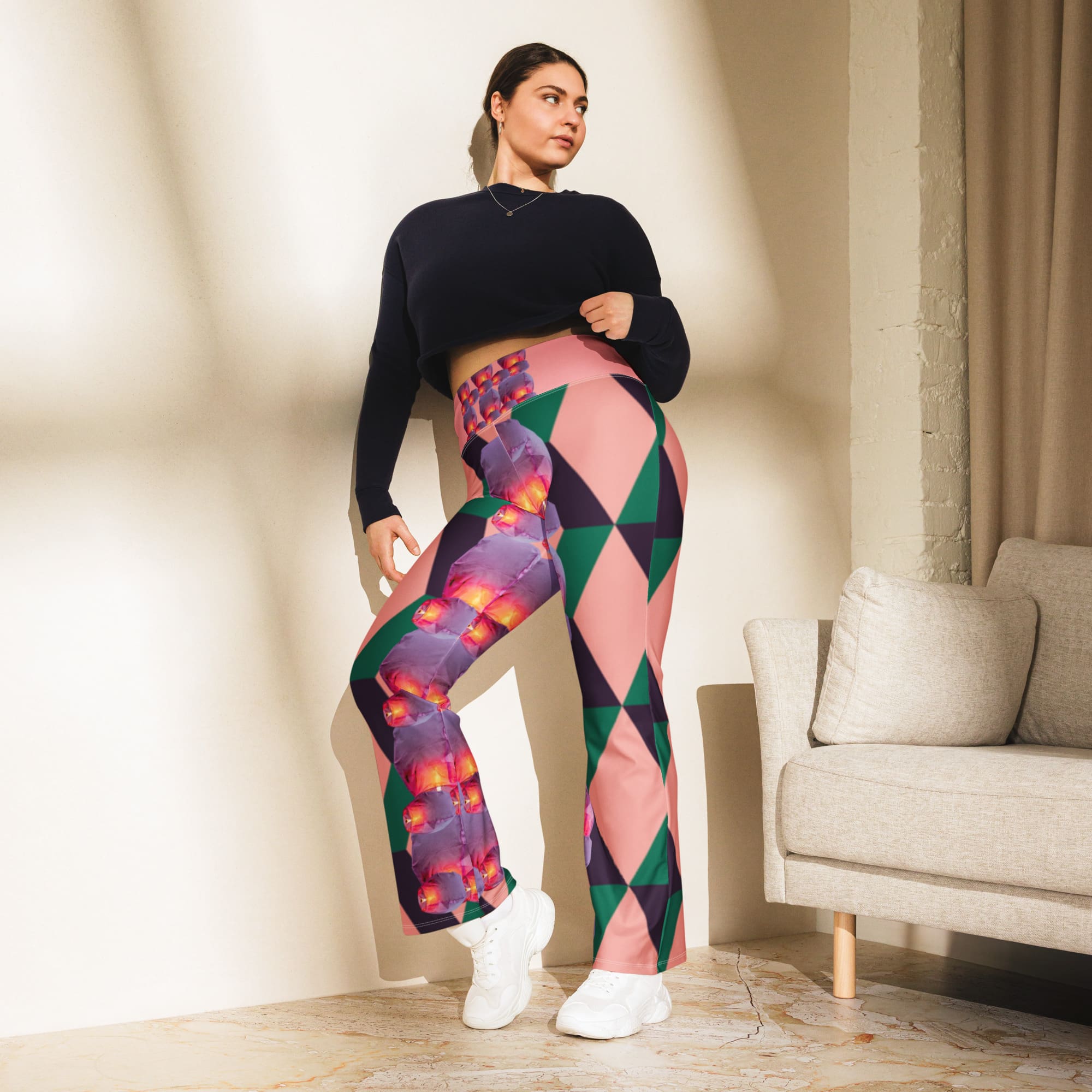 Woman wearing colorful geometric leggings and black sweater