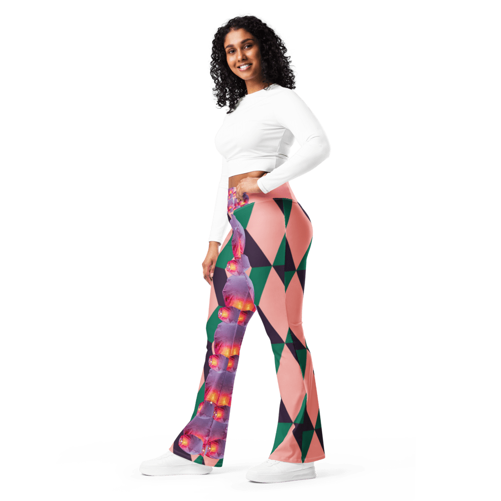 Smiling model in colorful bell-bottoms and white top