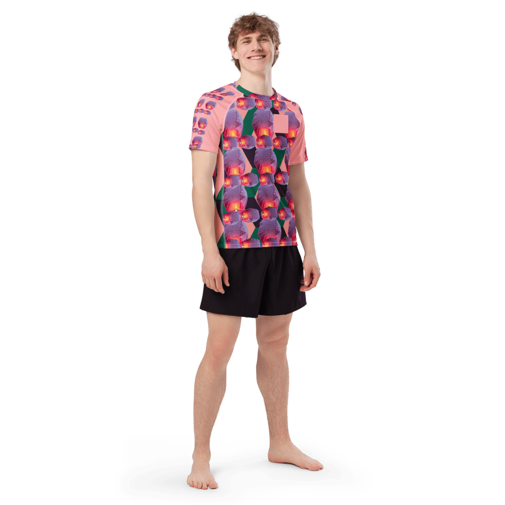 Young man barefoot in vibrant graphic tee