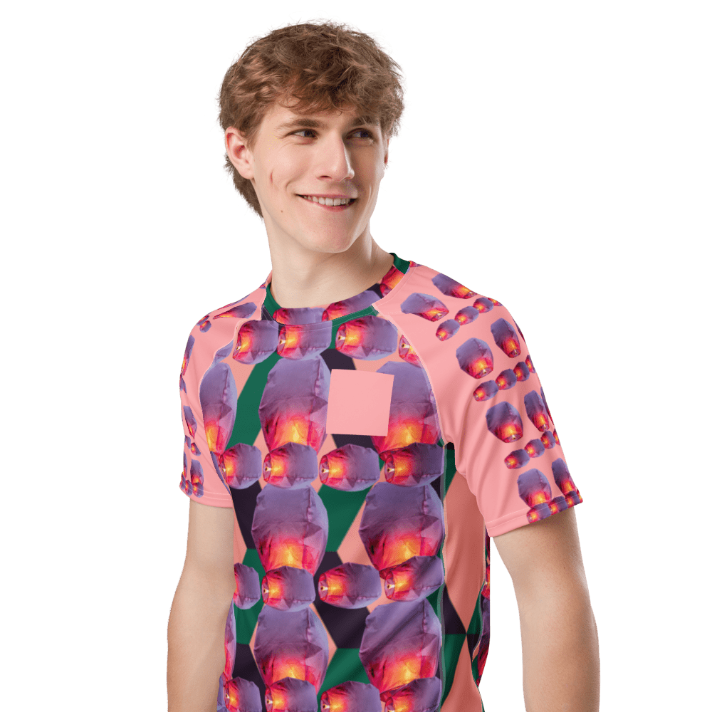 Smiling person wearing vibrant kaleidoscope shirt