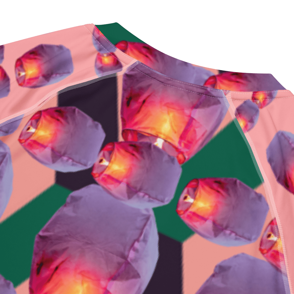 Repeating pink paper lantern pattern on fabric