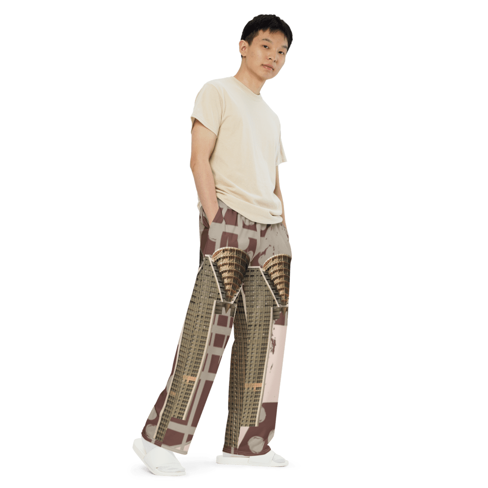 Man in beige tee and architectural-print wide-leg pants